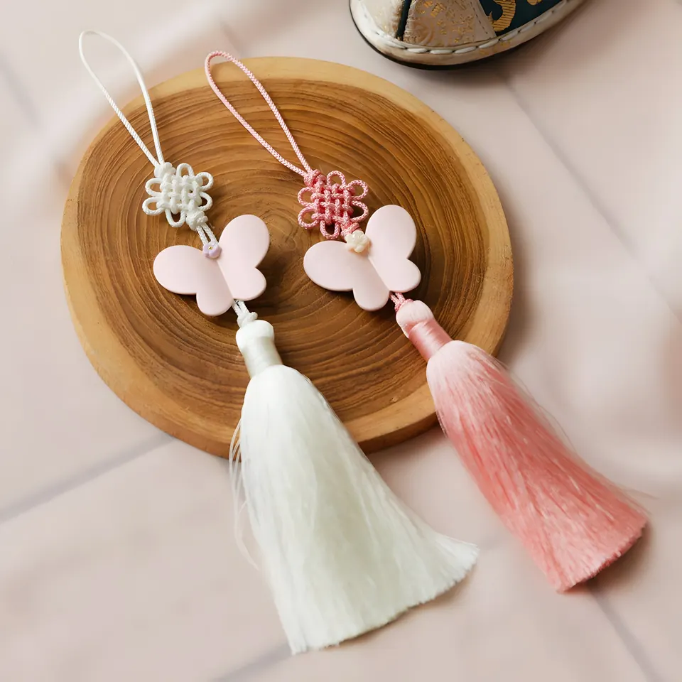 The Butterfly Mini Norigae, accessory from the collection, product photograph